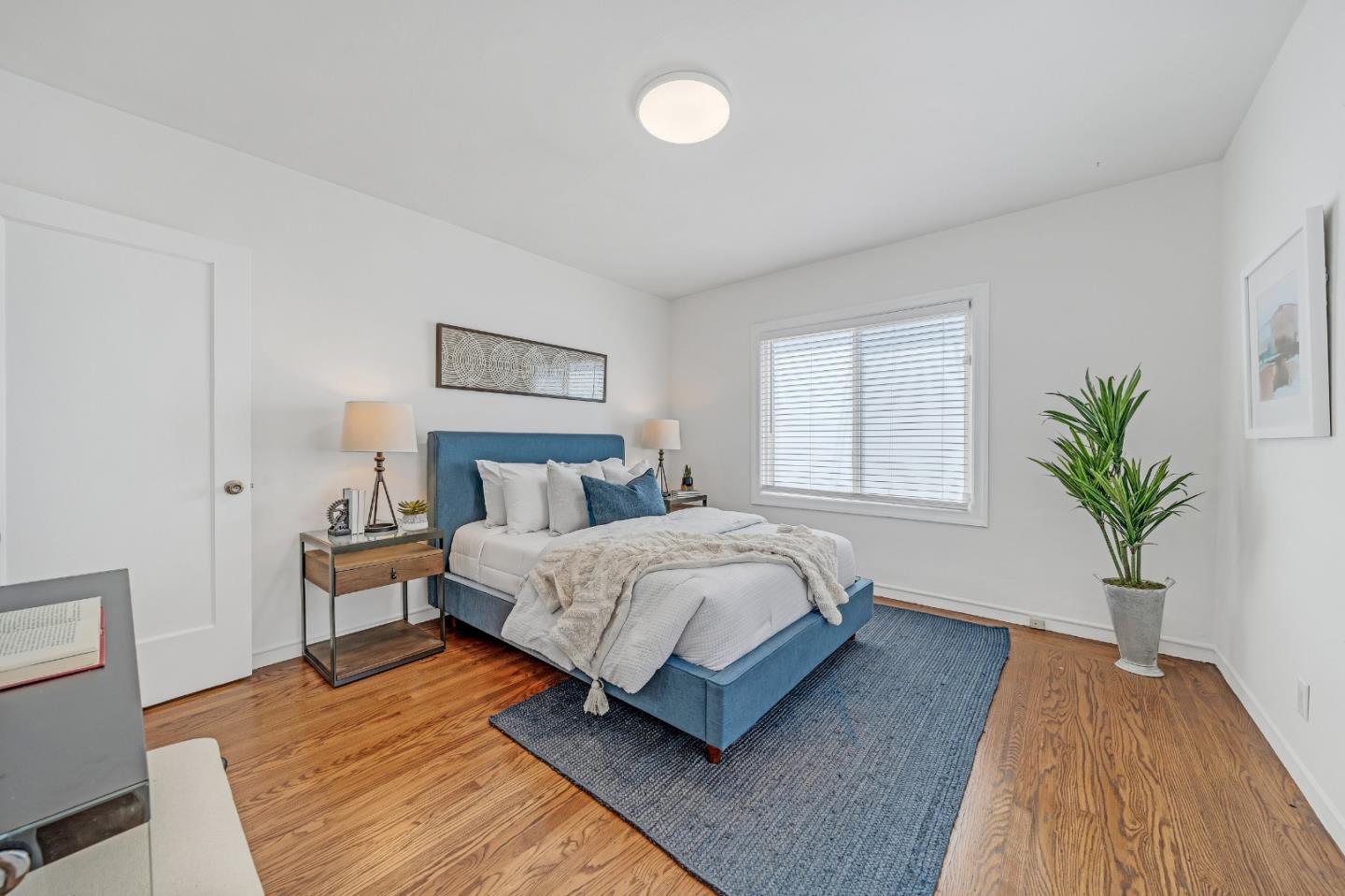 1490 Plaza Drive San Leandro, CA 94578 - Photo 23 of 39 a spacious bedroom with a large bed and a potted plant