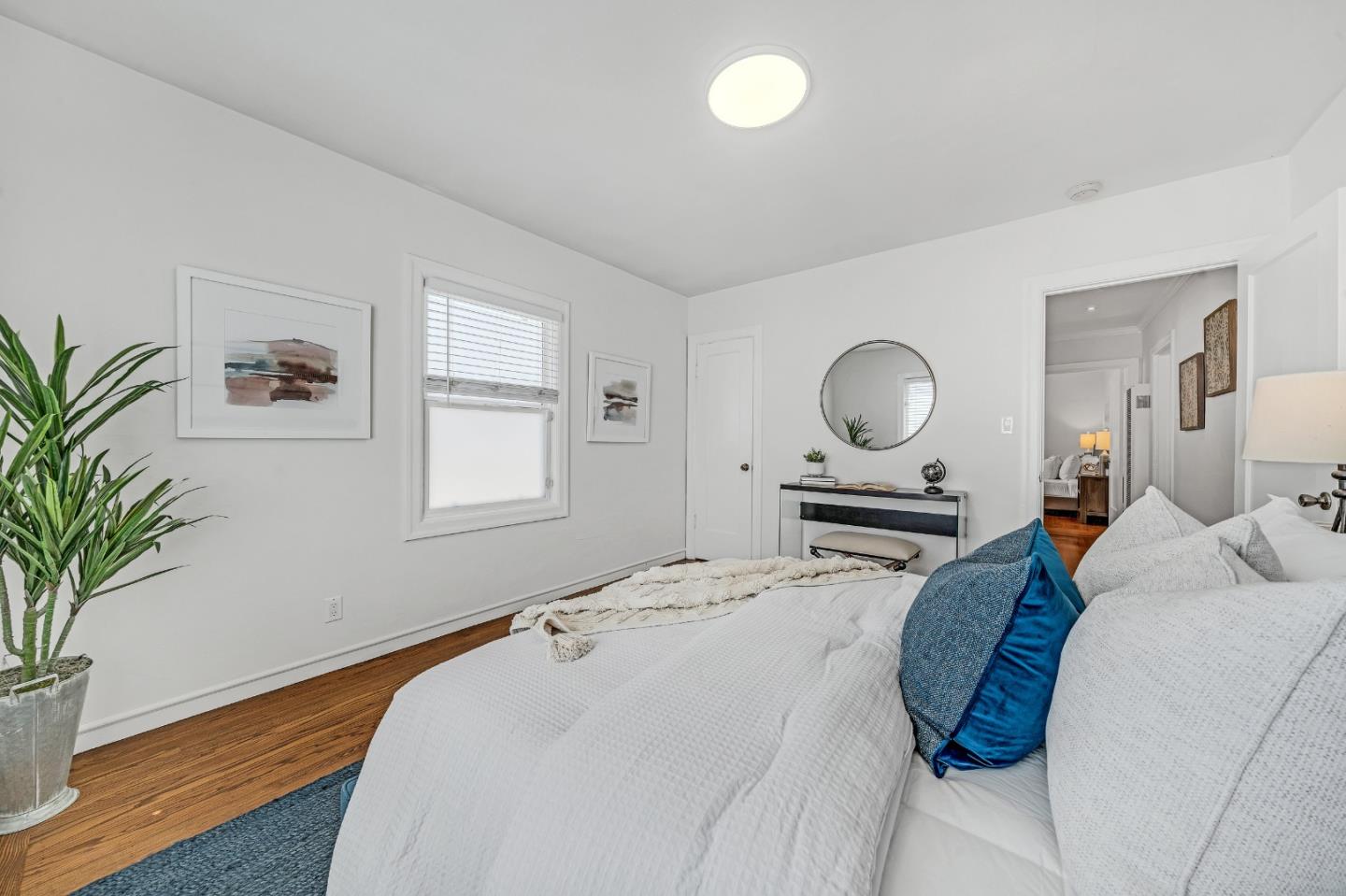 1490 Plaza Drive San Leandro, CA 94578 - Photo 24 of 39 a bedroom with a bed and a potted plant