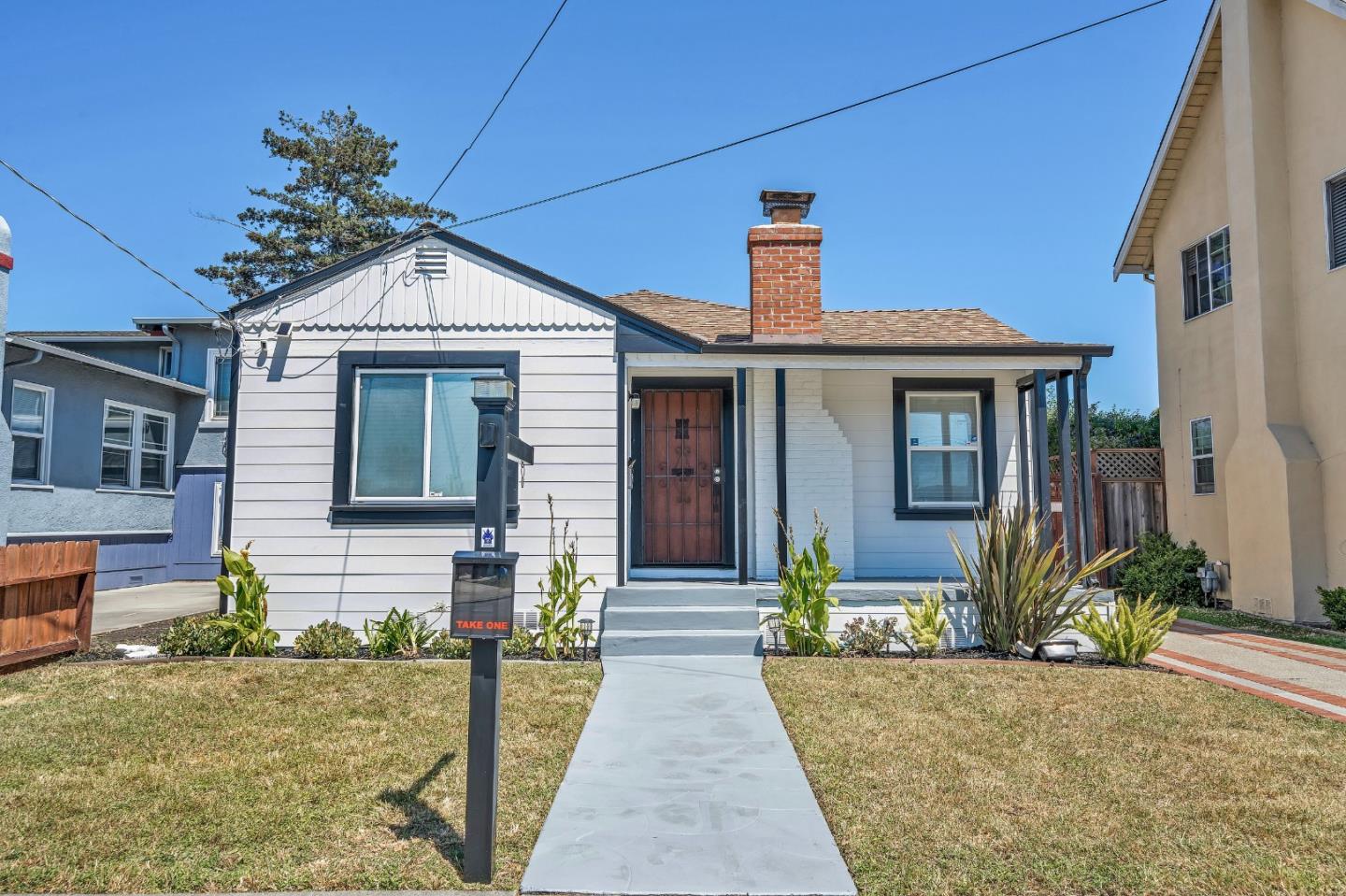 1490 Plaza Drive San Leandro, CA 94578 - Photo 33 of 39 a front view of a house with a yard and potted plants