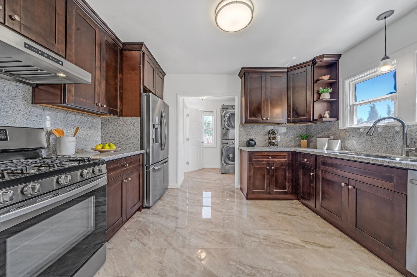 1490 Plaza Drive San Leandro, CA 94578 - Photo 10 of 39 a kitchen with stainless steel appliances granite countertop a stove top oven a sink and dishwasher