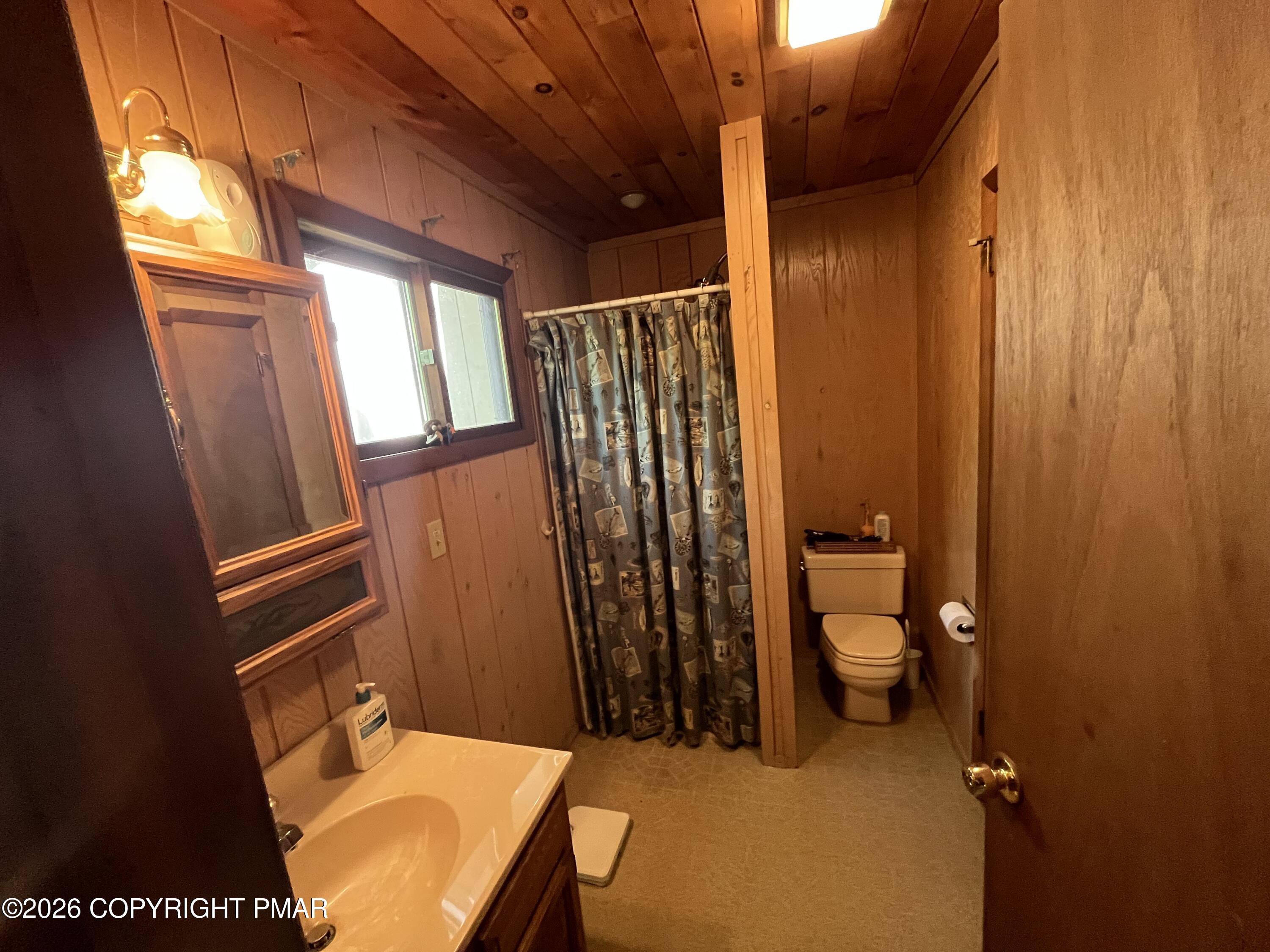5970 Decker Road Bushkill, PA 18324 - Photo 26 of 26 a bathroom with a toilet a sink and shower