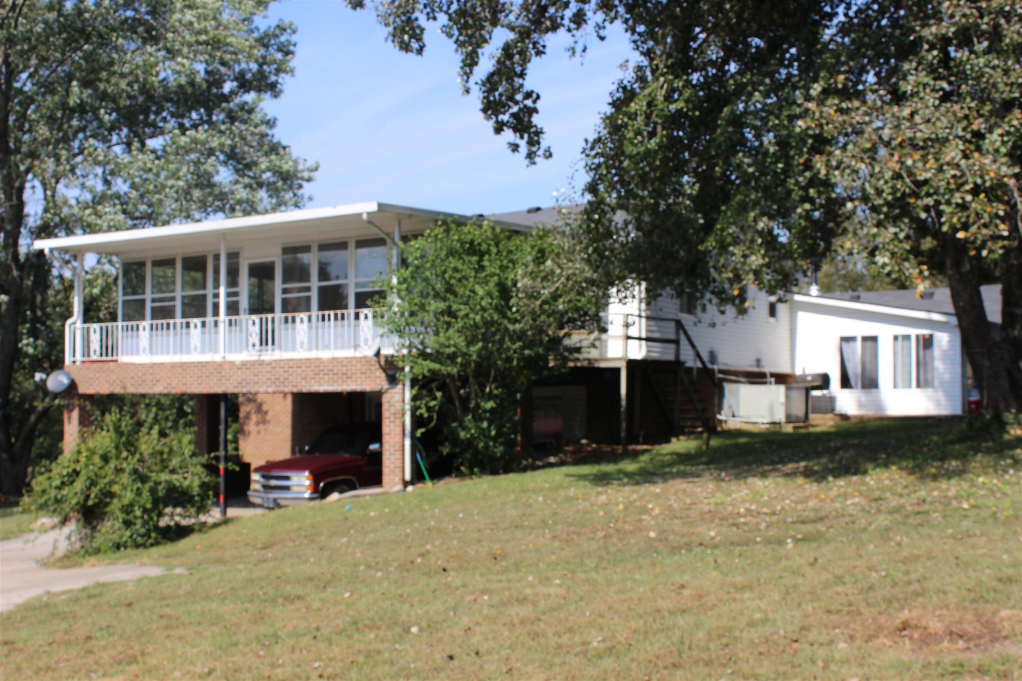 340 Pee Dee Branch Road Cottontown, TN 37048 - Photo 17 of 17 a front view of a house with a yard and garage