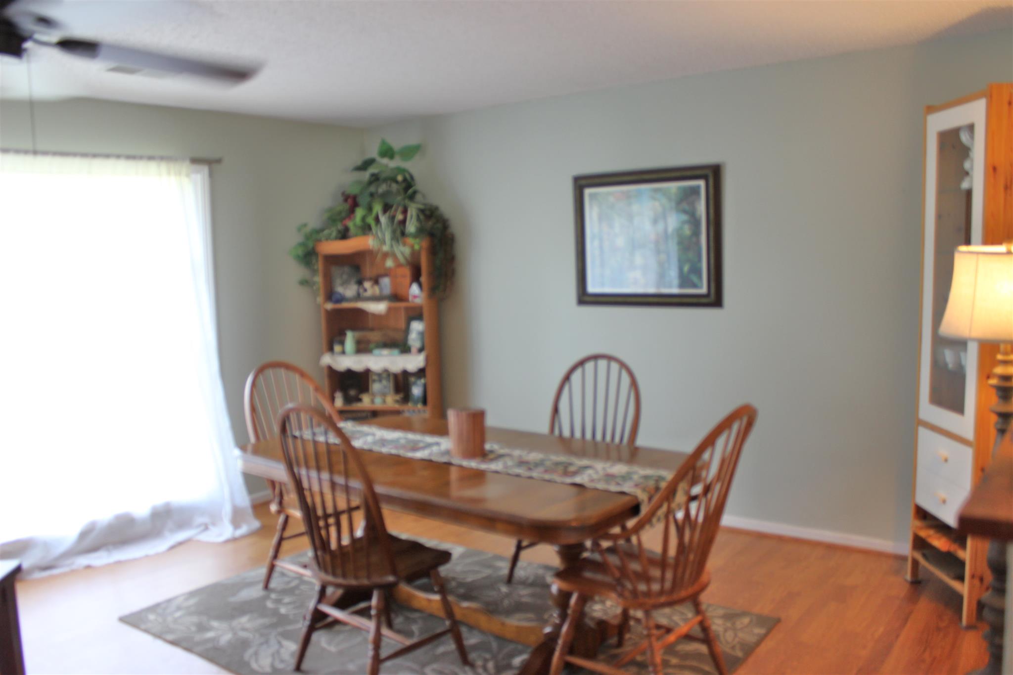 340 Pee Dee Branch Road Cottontown, TN 37048 - Photo 4 of 17 a view of a dining room with furniture and window