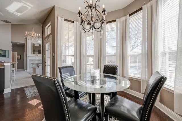 a kitchen with stainless steel appliances granite countertop a refrigerator a stove top oven and a refrigerator