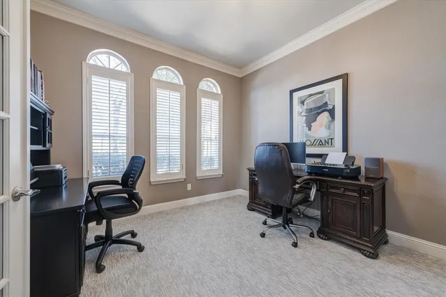 a spacious bedroom with a bed and a television in it