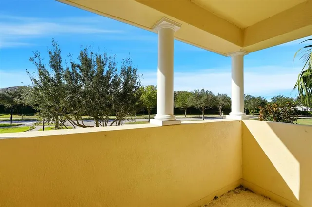 a view of a swimming pool with an outdoor seating