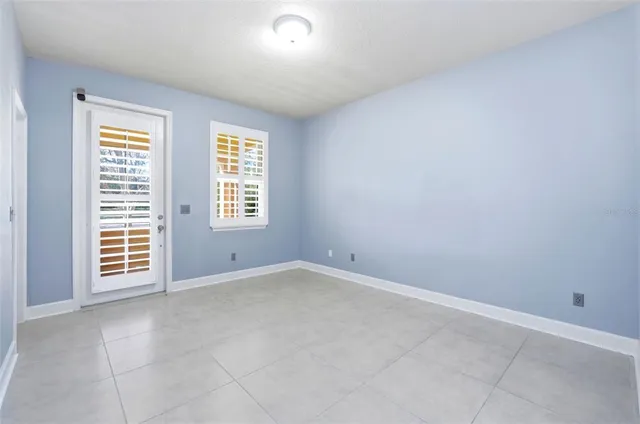 an empty room with windows