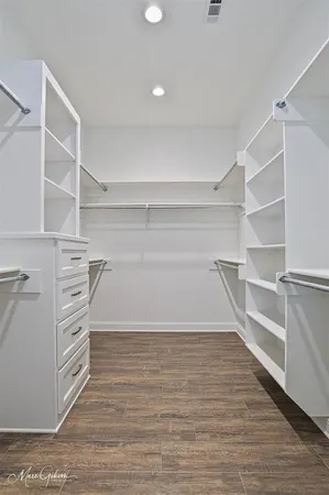 a view of an empty walk in closet