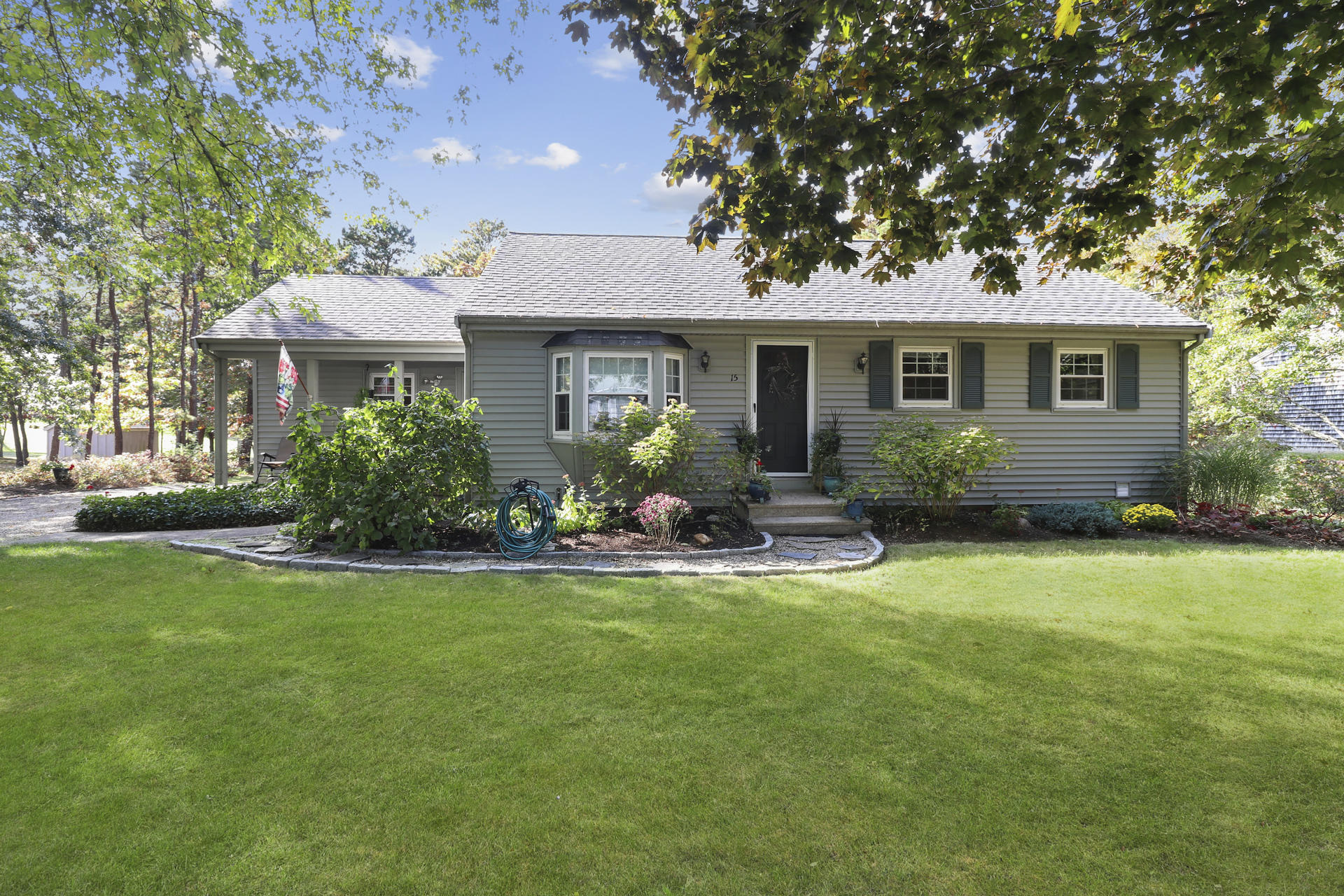 15 Ronda Lane Dennis, MA 02638 - Photo 1 of 20 a front view of house with yard and green space