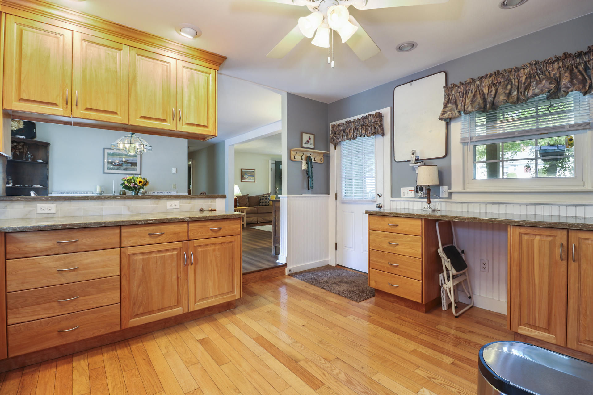15 Ronda Lane Dennis, MA 02638 - Photo 7 of 20 a large kitchen with stainless steel appliances granite countertop a stove a sink dishwasher and cabinets with wooden floor