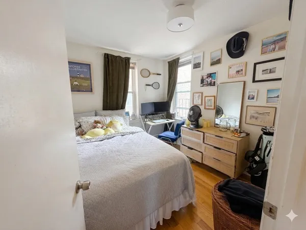 a bed room with a bed furniture and a window