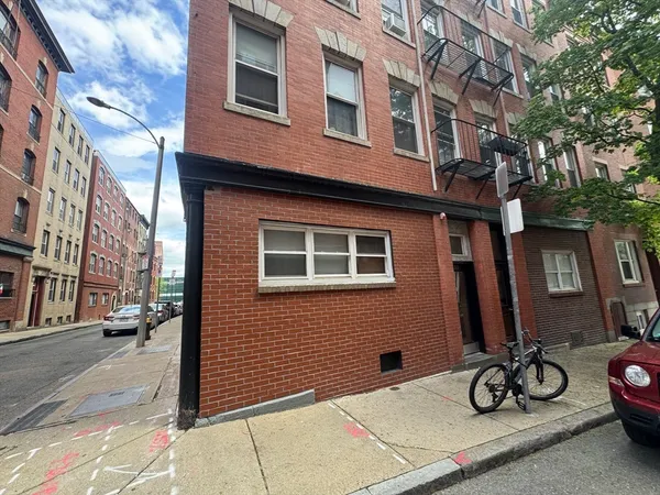 a view of a brick building with many windows