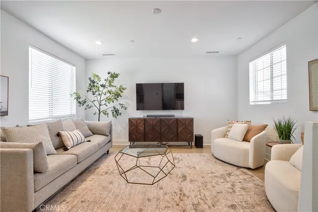 a living room with furniture and a large window