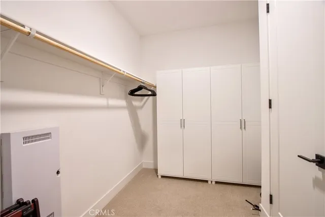 a view of front door with furniture and a window