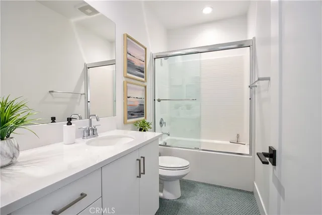 a kitchen with a sink cabinets and appliances