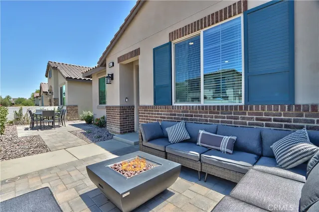a outdoor living space with furniture and a rug
