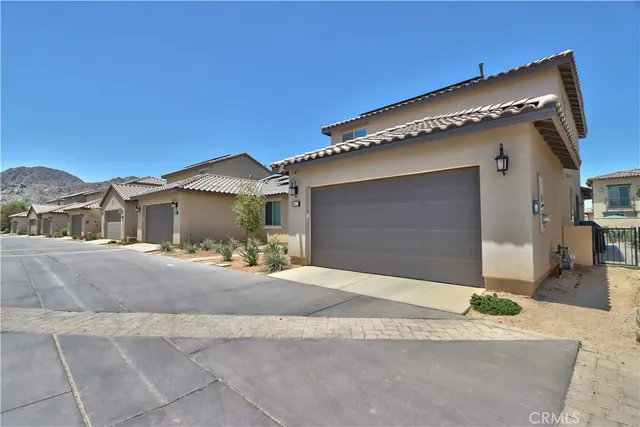 a view of a livingroom with furniture and a flat screen tv