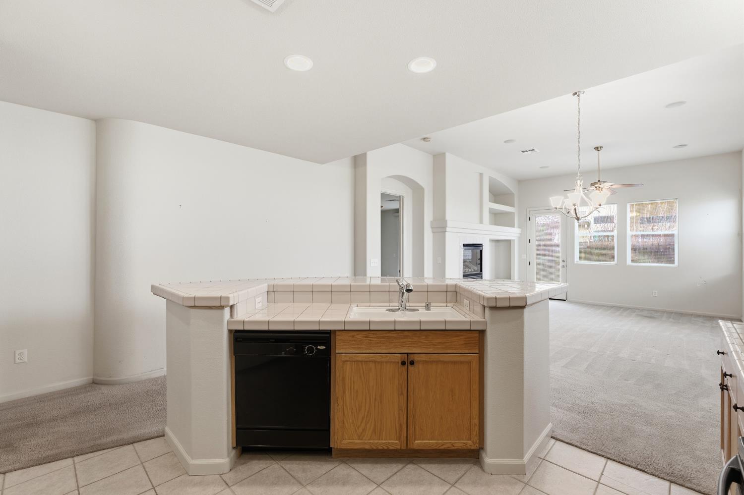2450 Como Corte Chowchilla, CA 93610 - Photo 16 of 42 a spacious bathroom with a granite countertop sink a mirror and a vanity