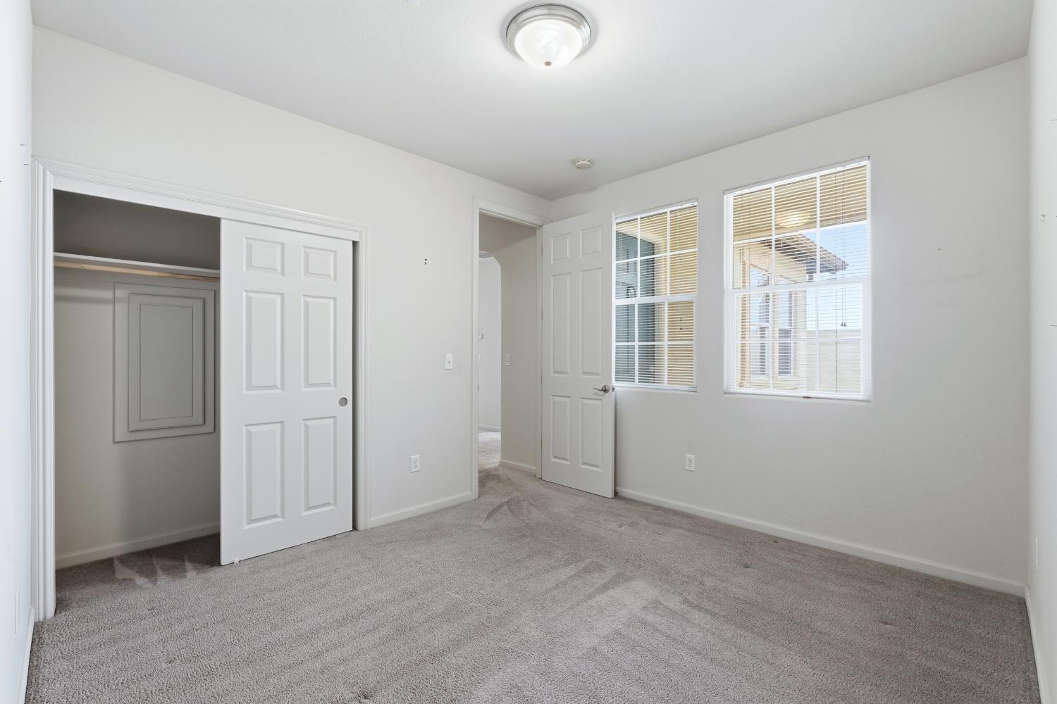 2450 Como Corte Chowchilla, CA 93610 - Photo 24 of 42 an empty room with windows
