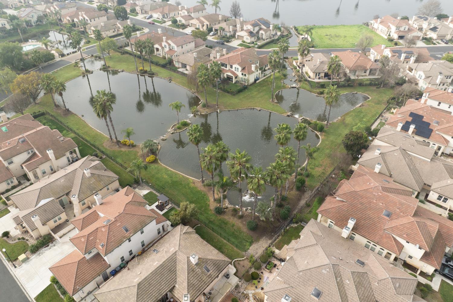 2450 Como Corte Chowchilla, CA 93610 - Photo 37 of 42 an aerial view of a house with a lake view
