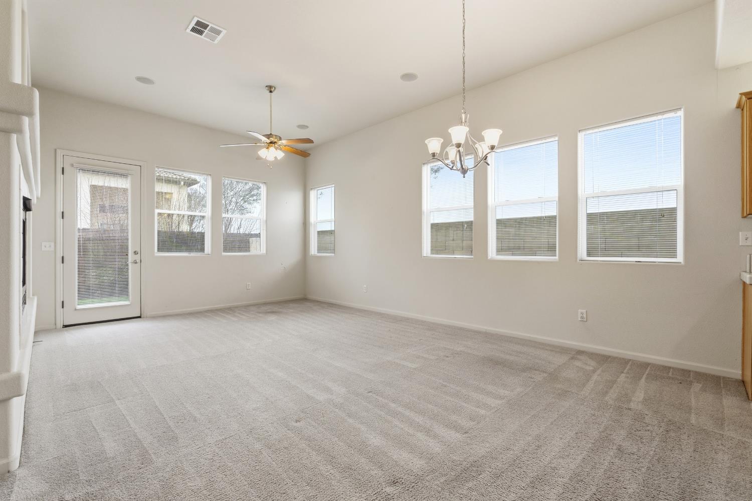2450 Como Corte Chowchilla, CA 93610 - Photo 6 of 42 a view of an empty room with a window