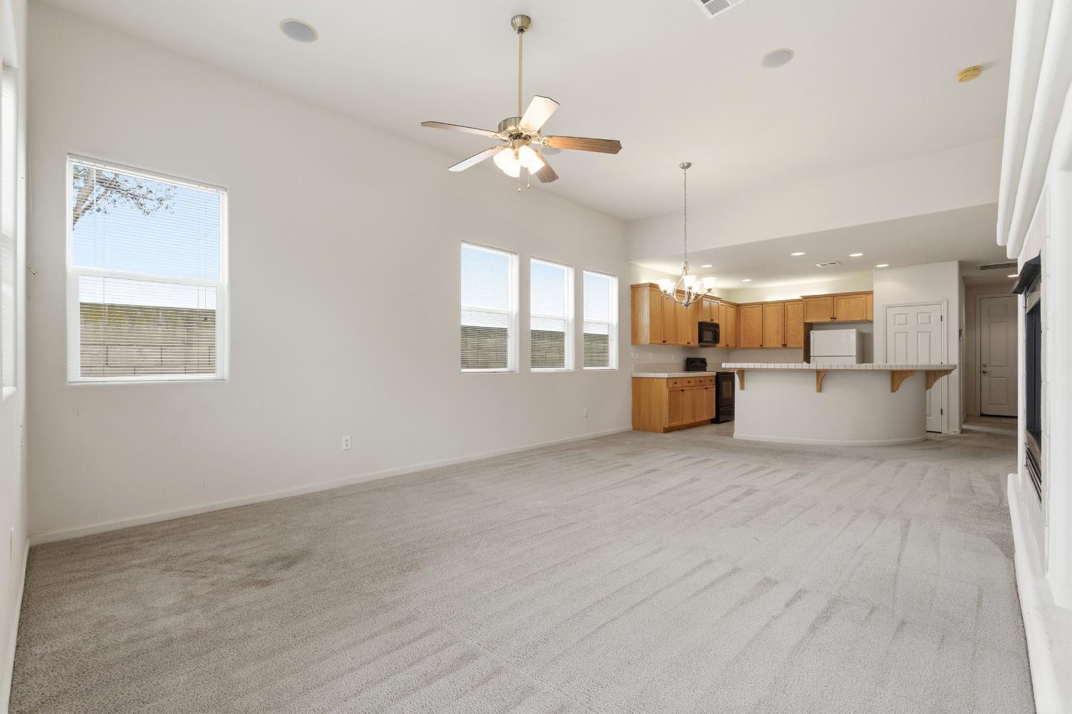 2450 Como Corte Chowchilla, CA 93610 - Photo 9 of 42 a view of a kitchen with a stove cabinets and a kitchen