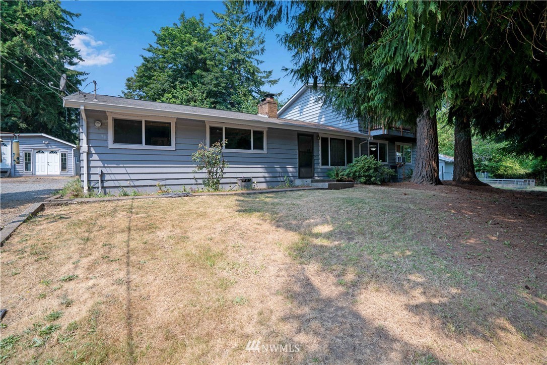 a house with trees in the background