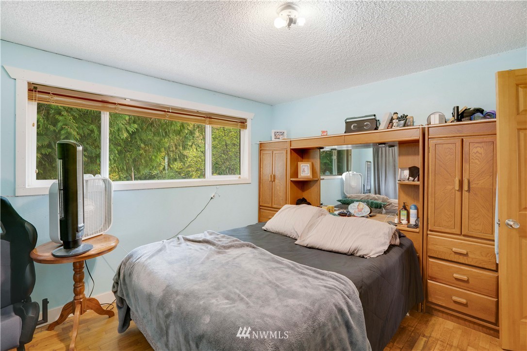 16619 192nd Avenue Southeast Renton, WA 98058 - Photo 11 of 37 a bedroom with a bed and wooden floor
