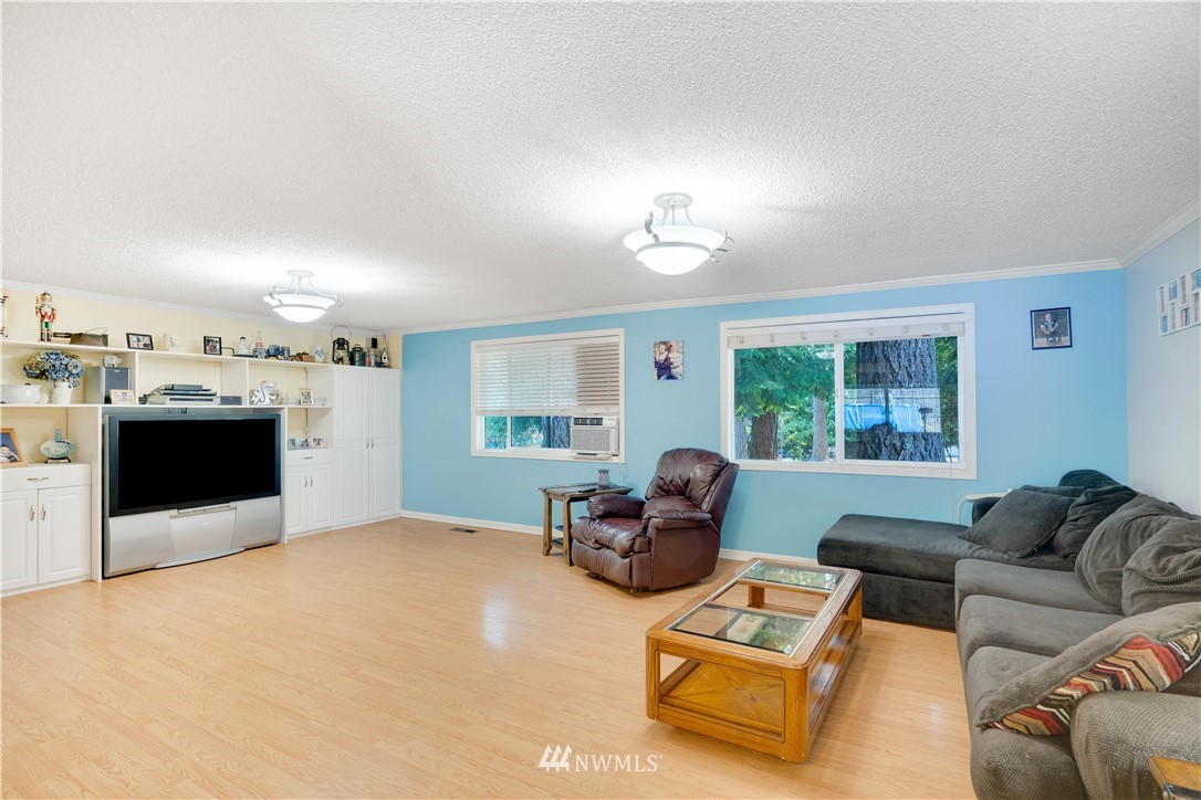 16619 192nd Avenue Southeast Renton, WA 98058 - Photo 15 of 37 a living room with furniture and a flat screen tv