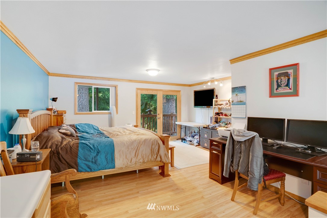 16619 192nd Avenue Southeast Renton, WA 98058 - Photo 19 of 37 a bedroom with furniture and a flat screen tv