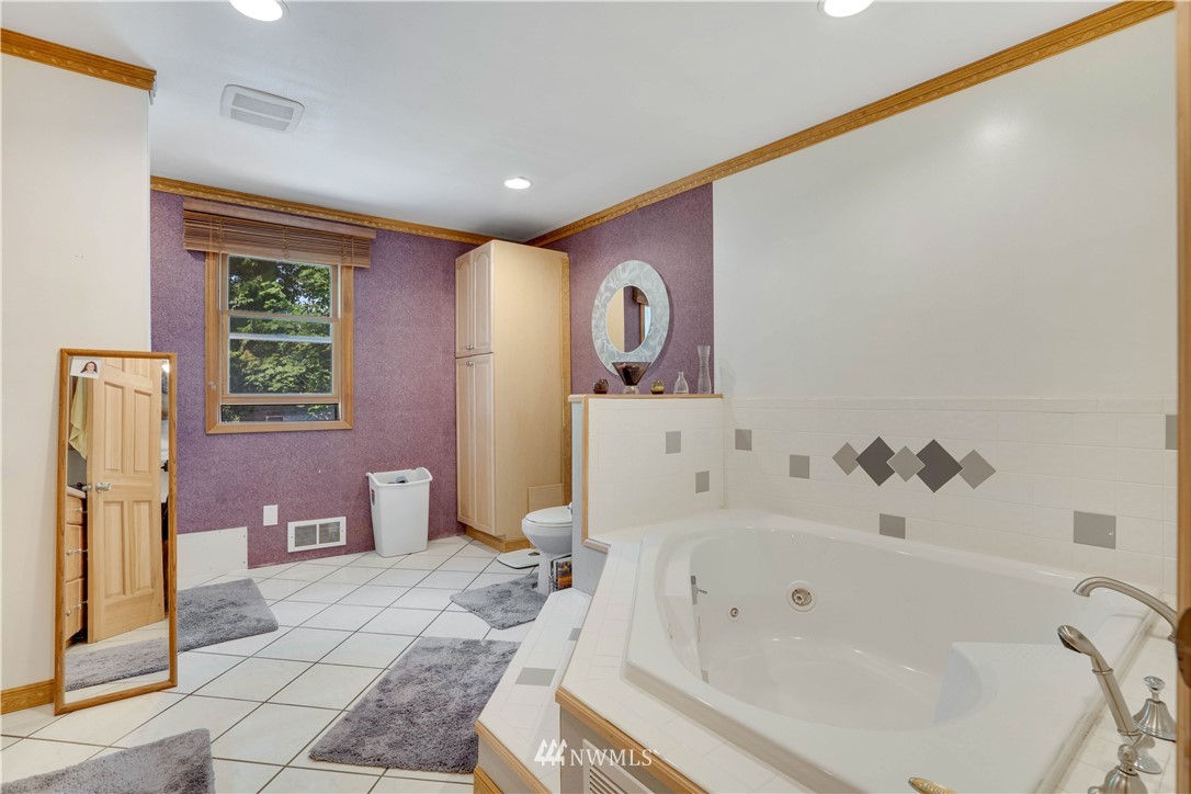 16619 192nd Avenue Southeast Renton, WA 98058 - Photo 22 of 37 a bathroom with a bathtub and a shower