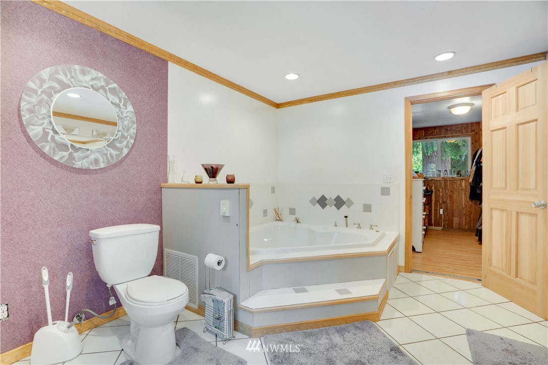 16619 192nd Avenue Southeast Renton, WA 98058 - Photo 23 of 37 a bathroom with a toilet sink tub and mirror