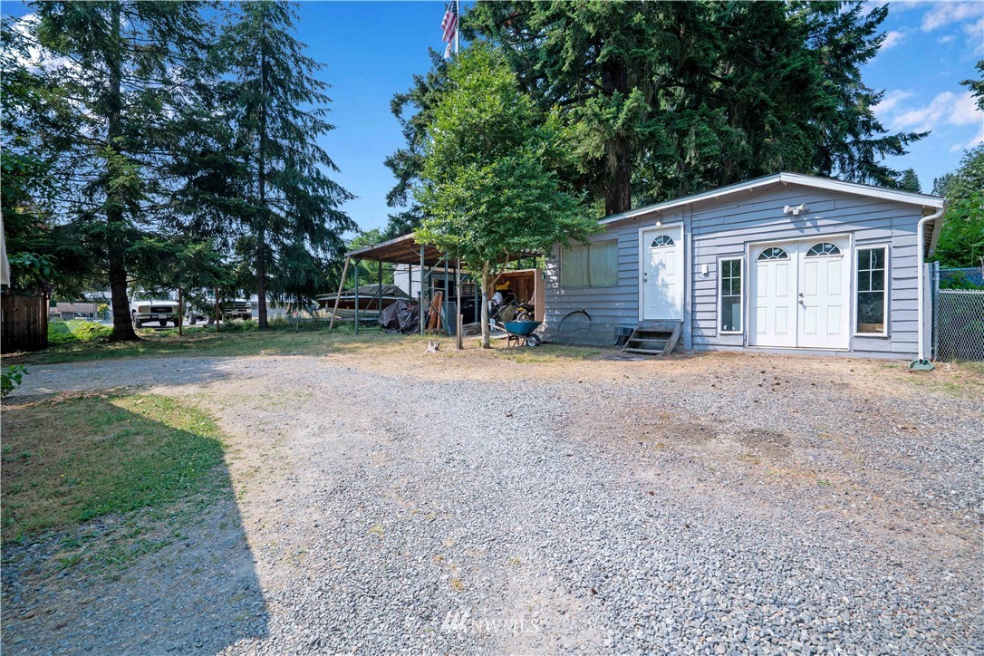 16619 192nd Avenue Southeast Renton, WA 98058 - Photo 30 of 37 a view of a house with a yard and large trees