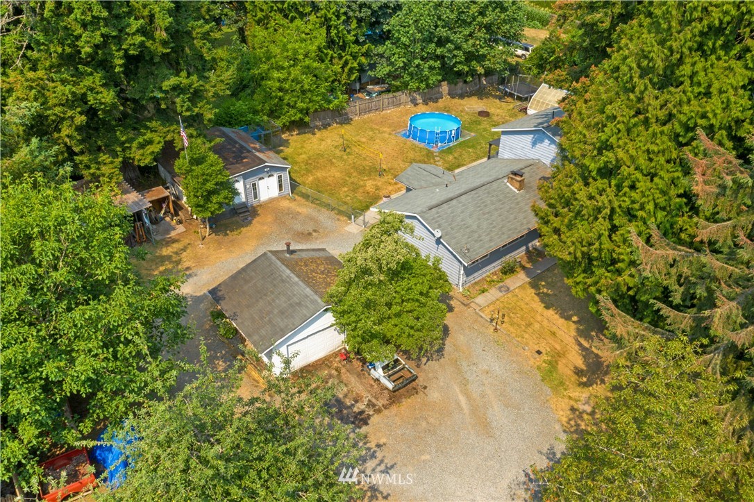 16619 192nd Avenue Southeast Renton, WA 98058 - Photo 34 of 37 an aerial view of a house with a yard and trees all around