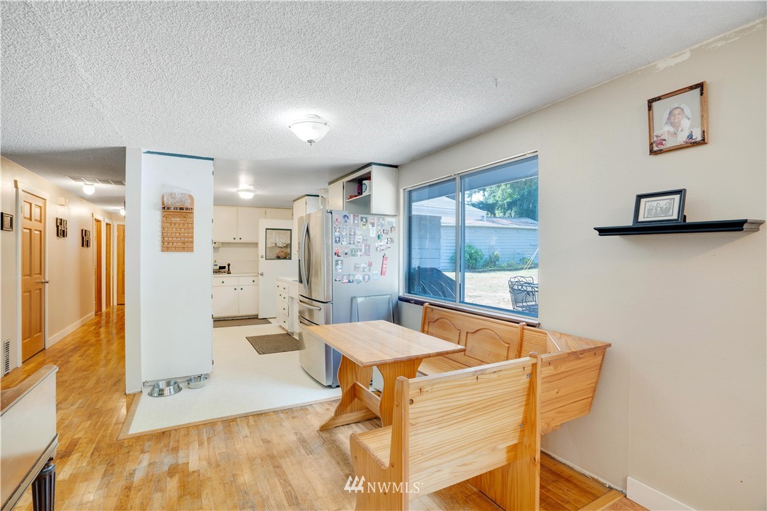 16619 192nd Avenue Southeast Renton, WA 98058 - Photo 8 of 37 a view of a dining room with furniture and a window