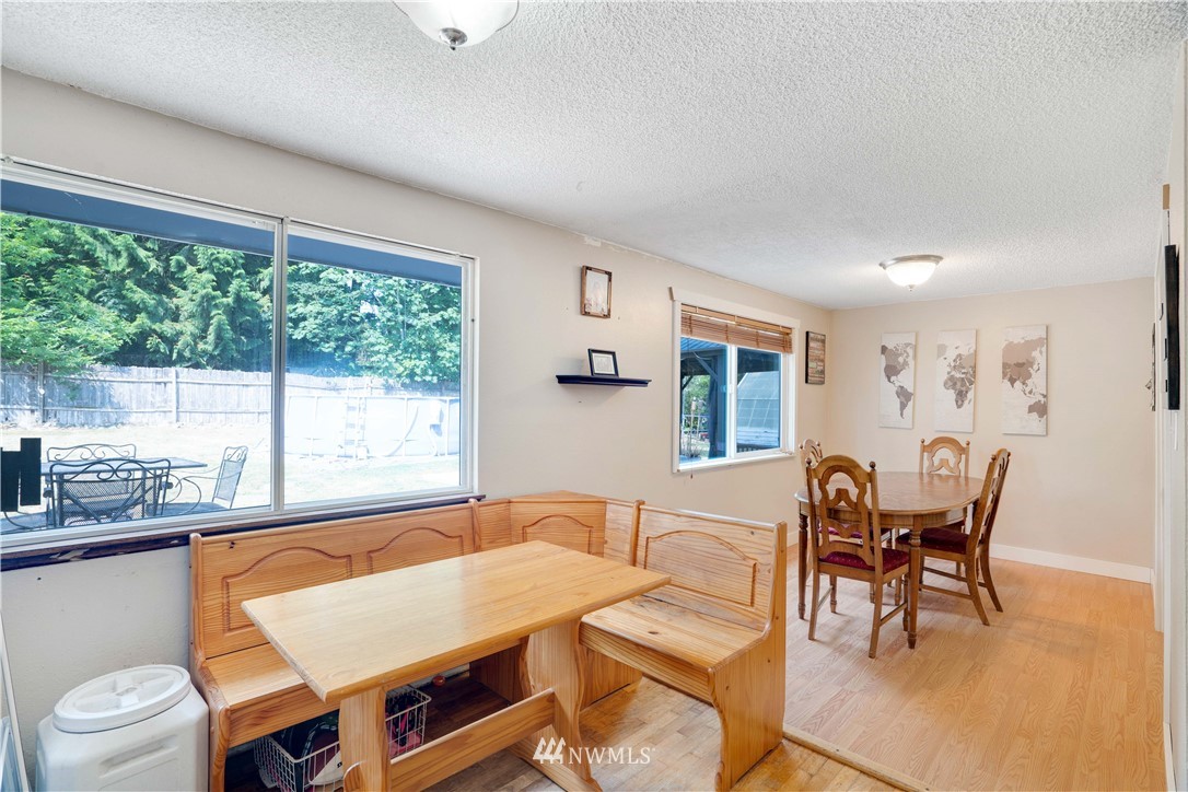16619 192nd Avenue Southeast Renton, WA 98058 - Photo 9 of 37 a view of a dining room with furniture window and outside view