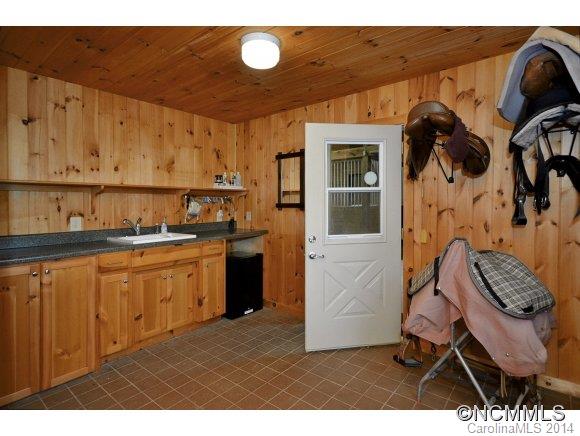 111 Pardo Road Landrum, SC 29356 - Photo 23 of 24 a kitchen with stainless steel appliances kitchen island granite countertop a sink and cabinets