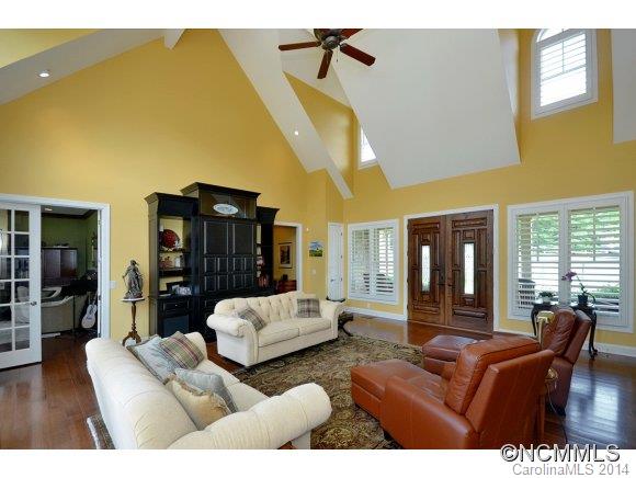 111 Pardo Road Landrum, SC 29356 - Photo 4 of 24 a living room with furniture and a chandelier