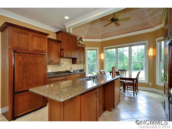 111 Pardo Road Landrum, SC 29356 - Photo 8 of 24 a kitchen with a table chairs and wooden floor