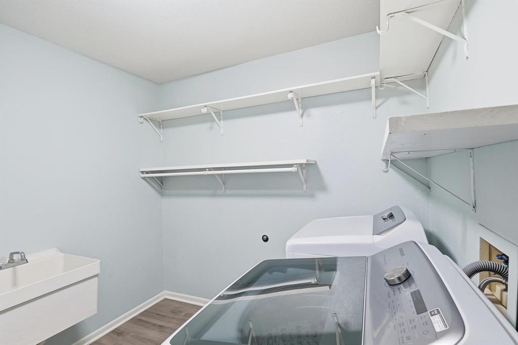 3873 Lois Road East Sanger, TX 76266 - Photo 30 of 40 Huge utility room with washer and dryer, sink and storage!