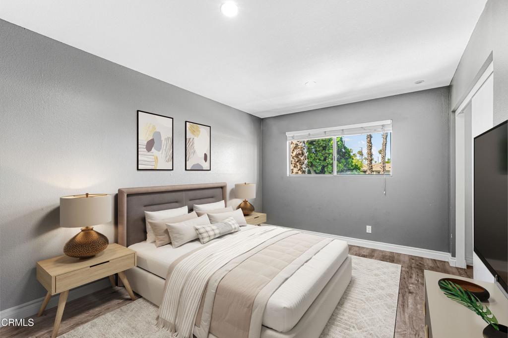 1920 North H Street, Unit 233 Oxnard, CA 93036 - Photo 11 of 26 a bedroom with a bed and a flat screen tv