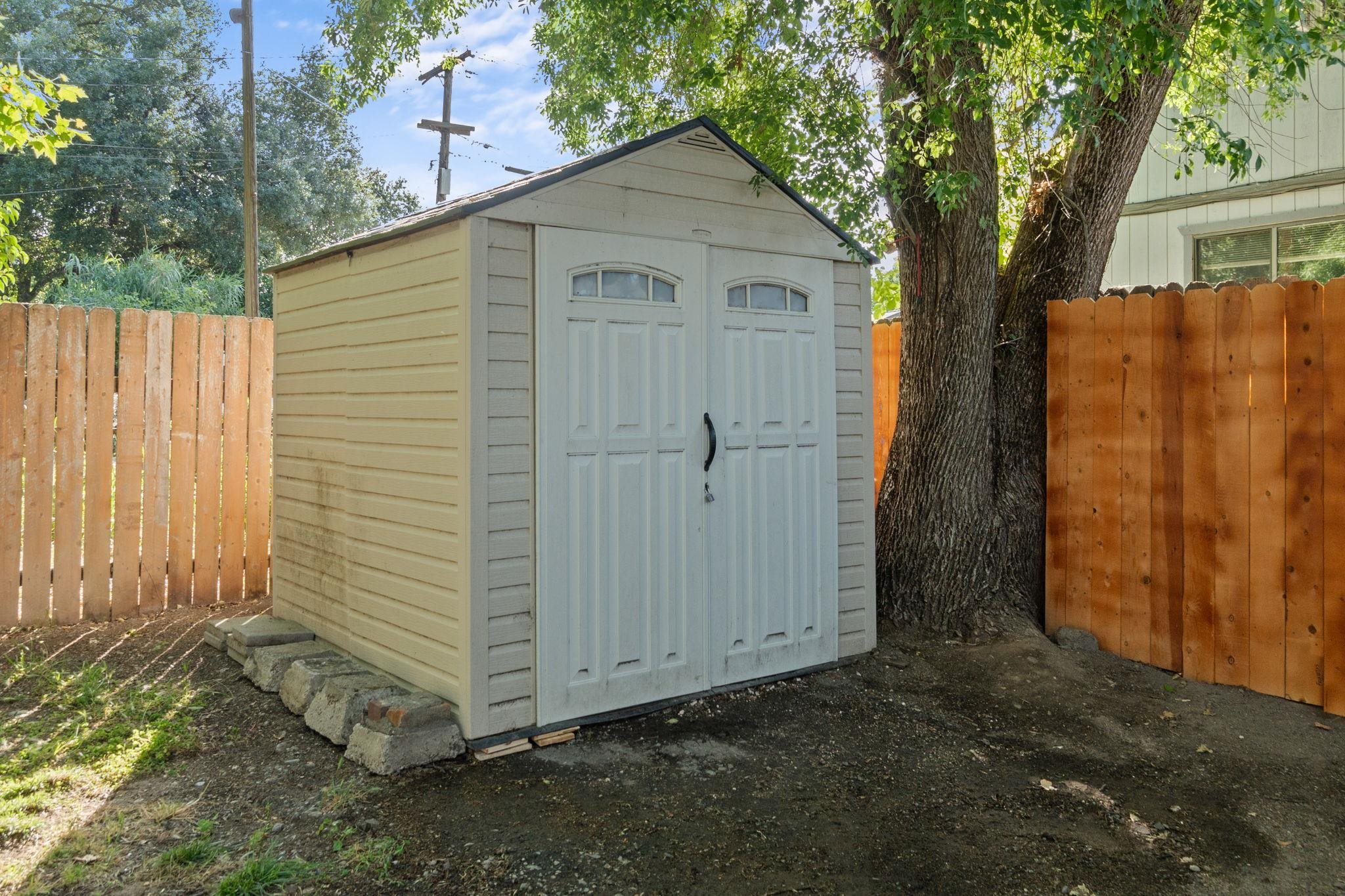 355 Jackson Street Red Bluff, CA 96080 - Photo 20 of 24 a view of a house with a yard and garage