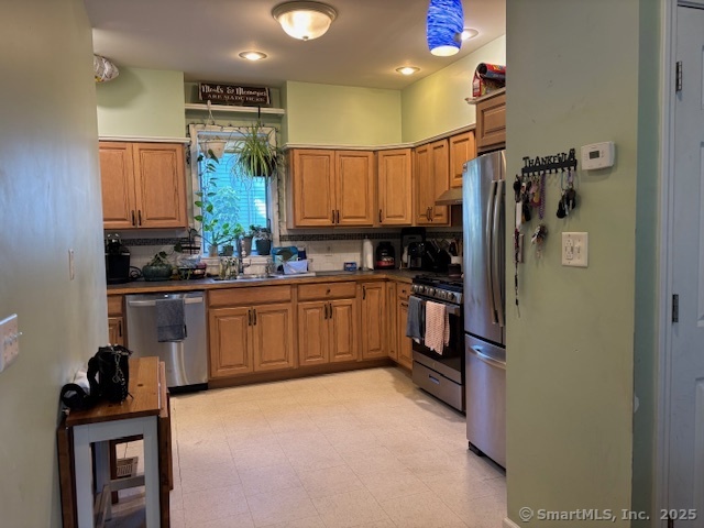 193 Wakelee Avenue Ansonia, CT 06401 - Photo 15 of 38 a kitchen with a sink refrigerator and cabinets