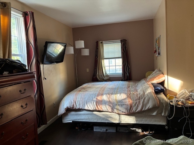 193 Wakelee Avenue Ansonia, CT 06401 - Photo 20 of 38 a bedroom with a bed and a mirror