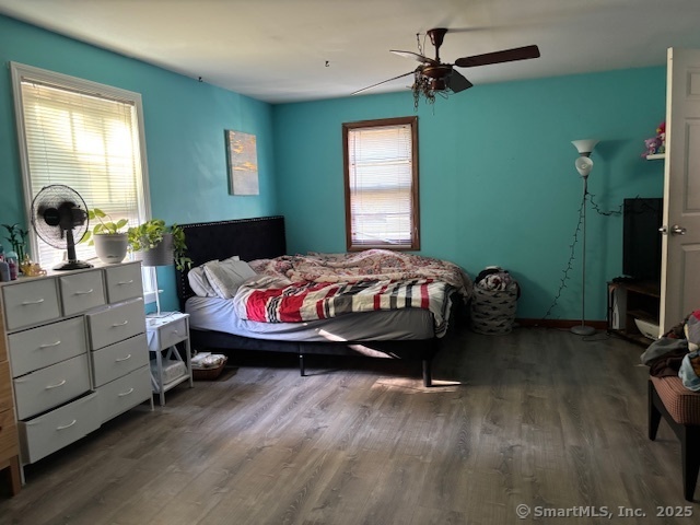 193 Wakelee Avenue Ansonia, CT 06401 - Photo 25 of 38 a bedroom with a bed and a chandelier