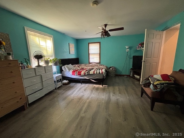 193 Wakelee Avenue Ansonia, CT 06401 - Photo 26 of 38 a bedroom with a bed and a mirror