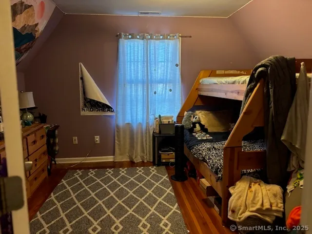 a bedroom with a bed and a closet