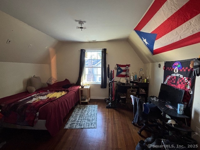 193 Wakelee Avenue Ansonia, CT 06401 - Photo 33 of 38 a living room with furniture and a flat screen tv with wooden floor