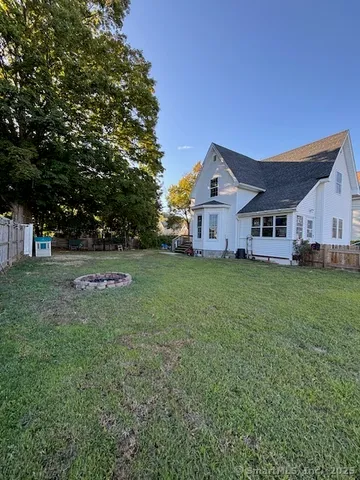 a view of a house with a back yard