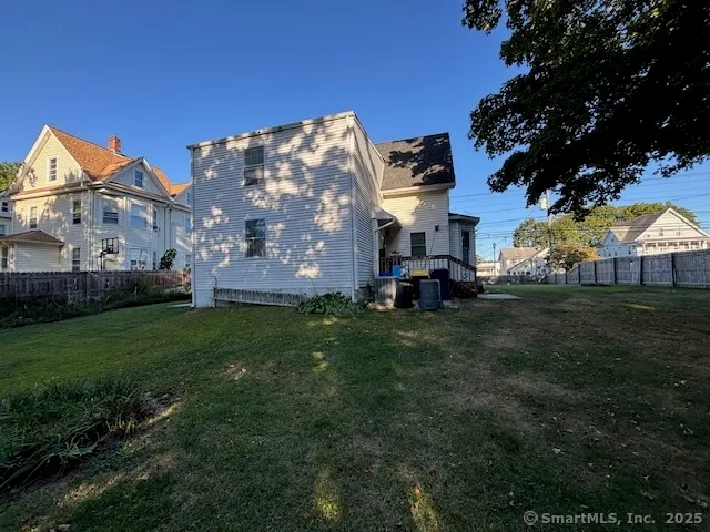 a view of a house with a back yard